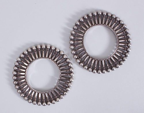 PAIR OF INDIAN SILVER BRACELETS IN THE FORM OF PINWHEELS