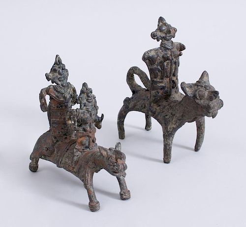 TWO INDIAN METAL FIGURES RIDING TIGERS