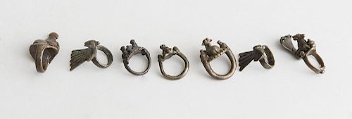GROUP OF SEVEN CENTRAL AND SOUTH INDIAN METAL RINGS