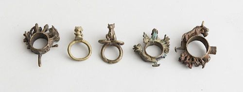GROUP OF FIVE INDIAN BRASS AND METAL RINGS