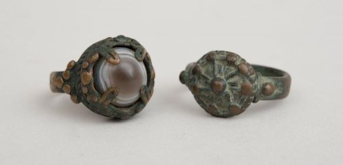 TWO INDIAN BRONZE RINGS