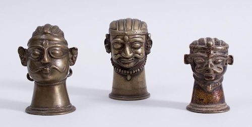 GROUP OF THREE INDIAN BRASS FIGURAL LINGAM COVERS