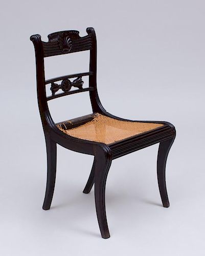 ANGLO-INDIAN CARVED EBONY AND CANED SIDE CHAIR, IN THE REGENCY TASTE