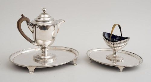 TWO ENGLISH SILVER-PLATED GRADUATED OVAL FOOTED TRAYS, A SILVER-PLATED ARGYLE AND A SUGAR BASKET WITH BLUE GLASS LINER