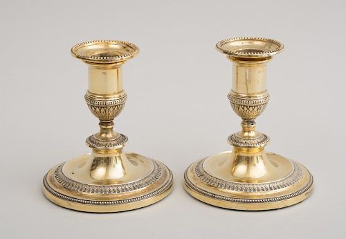 PAIR OF VICTORIAN WEIGHTED SILVER-GILT LOW CANDLESTICKS