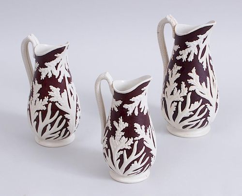 THREE BROWN-GLAZED POTTERY BEECH & HANCOCK JUGS IN GRADUATED SIZES IN THE 'SEAWEED' PATTERN