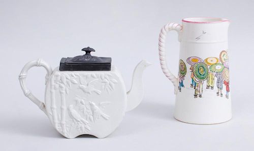 CREAMWARE 'JAPONAISE' PITCHER IN THE 'PARAPLUIE' PATTERN, AND AN ENGLISH DRABWARE TEAPOT MOLDED WITH BIRDS AND BAMBOO