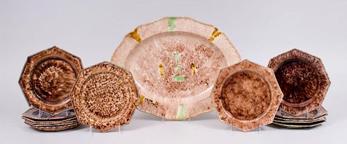 THIRTEEN STAFFORDSHIRE CREAMWARE 'TORTOISE SHELL' GLAZED OCTAGONAL PLATES AND AN OVAL-SHAPED PLATTER