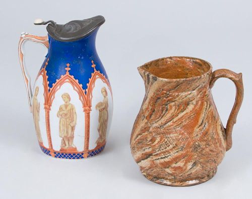 AGATEWARE PITCHER AND A TRANSFER PRINTED PITCHER AND COVER DECORATED IN THE GOTHIC STYLE