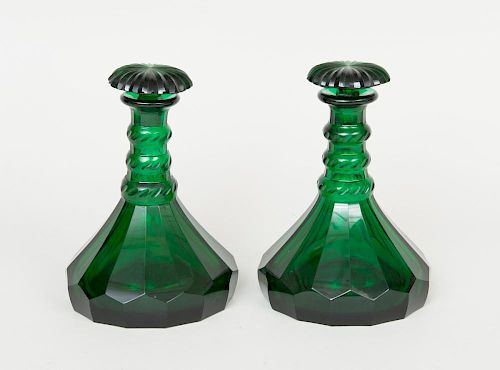 PAIR OF GREEN CUT GLASS DECANTERS AND STOPPERS