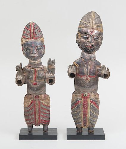 PAIR OF SOUTHEAST ASIAN PRESSED POLYCHROME TIN FIGURES ON WOOD STANDS