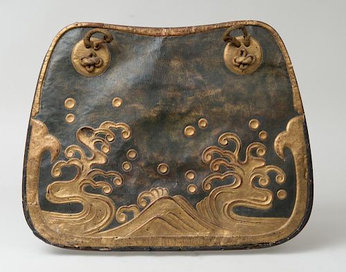 JAPANESE GILT AND EMBOSSED LEATHER HORSE CHAMFRON ON A MOUNTED WOOD SUPPORT