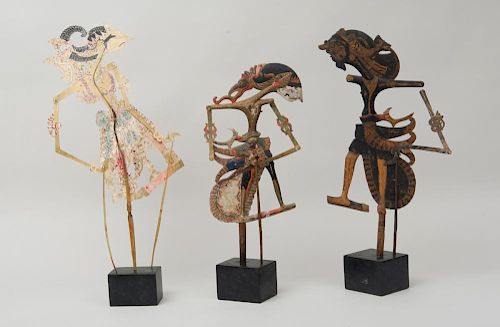 THREE BALINESE SHADOW PUPPETS, ON STANDS