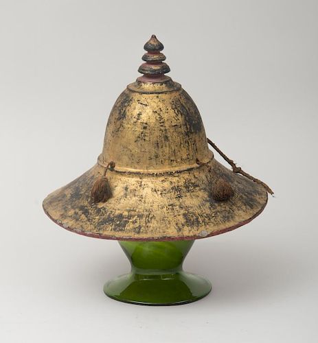 GILT-DECORATED ASIAN HAT ON A GREEN GLASS HAT STAND