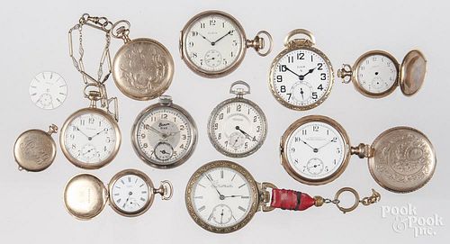 Collection of antique pocket watches and parts.