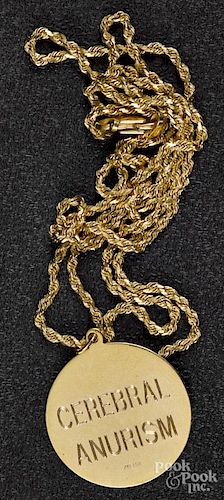 14K yellow gold necklace with medical tag