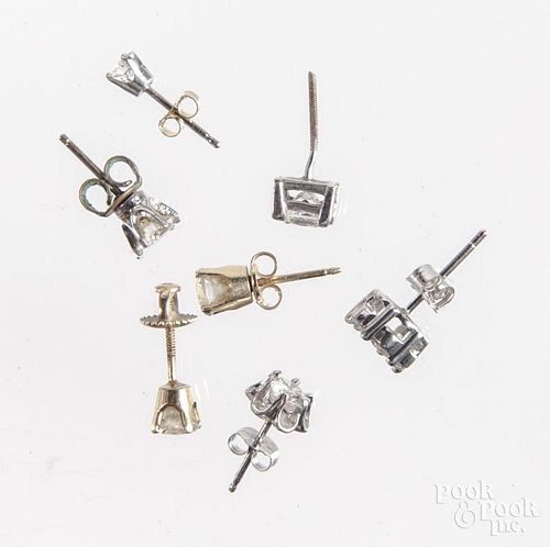 Seven assorted diamond stud earrings