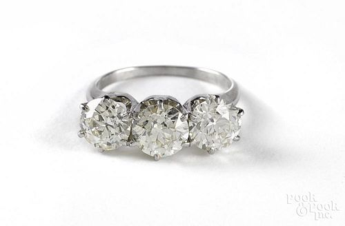 Platinum and miners cut diamond three stone ring