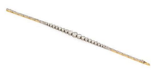 * An Edwardian Platinum Topped Gold and Diamond Line Bracelet, 9.50 dwts.
