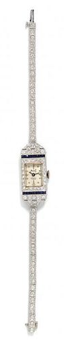 An Art Deco Platinum, Diamond and Synthetic Sapphire Wristwatch, 17.80 dwts.