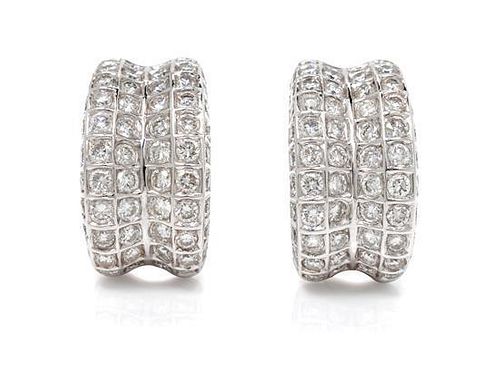 A Pair of 18 Karat White Gold and Diamond Earclips, 9.20 dwts.