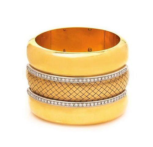 An 18 Karat Bicolor Gold and Diamond Wide Bangle Bracelet, 125.30 dwts.
