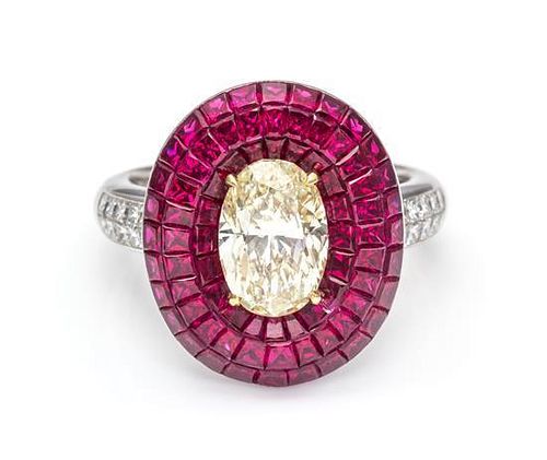 A Platinum, 18 Karat Yellow Gold, Diamond and Invisibly Set Ruby Ring, 7.90 dwts.