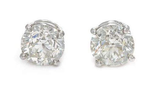 A Pair of Platinum and Diamond Stud Earrings, 4.00 dwts.