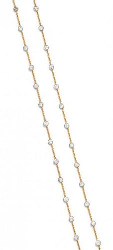 A Bicolor Gold and Diamond Station Necklace, 10.40 dwts.