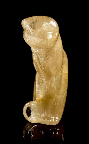 A Rutilated Quartz Cat Carving, Gerd Dreher,, Idar-Oberstein, Germany,, in a graceful stylized design, depicting a seated cat wi