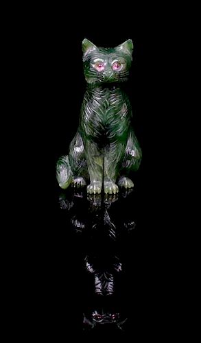 A Nephrite Cat Carving, 20th Century,, Russia,, realistically depicting a seated cat, the eyes inset with cabochon cut rubies, t