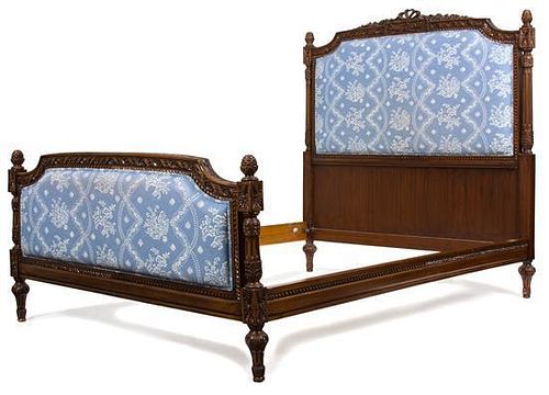 A Louis XVI Style Carved Mahogany Upholstered Headboard and Footboard