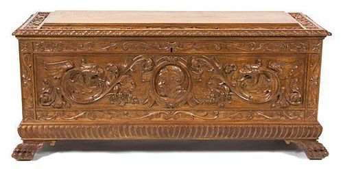 A Jacobean Style Carved Mahogany Cassone Height 22 x width 49 x depth 17 inches.