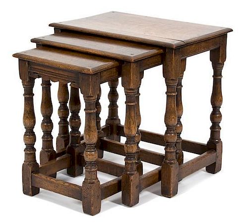 A Set of Three Jacobean Style Oak Nesting Tables Height 20 x width 20 1/2 x depth 14 inches.