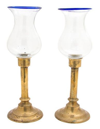 A Pair of American Brass Candlesticks with Blown Glass Hurricane Shades