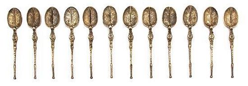 A Set of Twelve English Silver Demitasse Spoons, Thomas Bradbury & Sons, Sheffield, 1936, having turned handle and foliate-fo