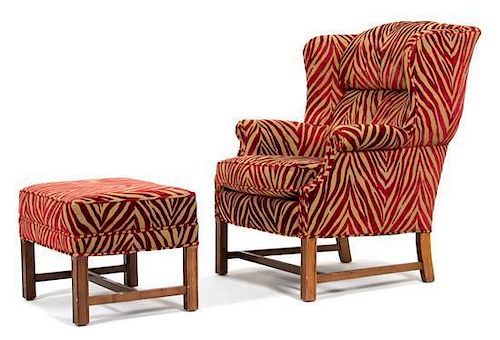An Upholstered Wing Chair and Matching Ottoman Height of chair 41 x width 31 x depth 33 inches.