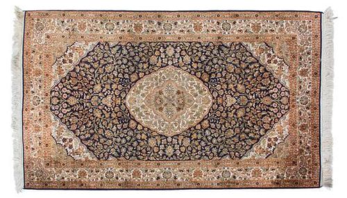 A Tabriz Silk and Wool Rug 6 feet 1 inch x 3 feet 2 inches.
