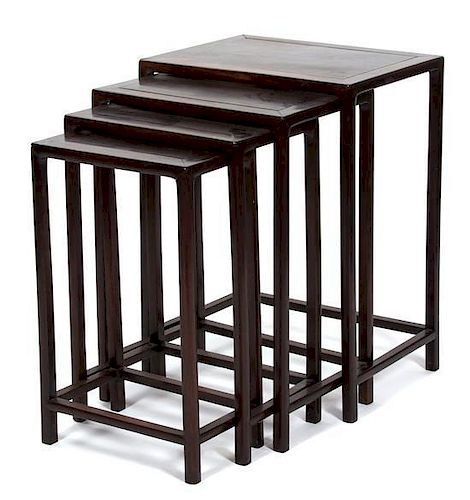 A Nest of Four Chinese Rosewood Nesting Tables Height 27 x width 20 x depth 14 3/4 inches.