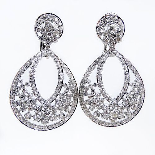 Van Cleef & Arpels style Approx. 7.24 Carat Round Brilliant Cut Diamond and 18 Karat White Gold Pendant earrings.