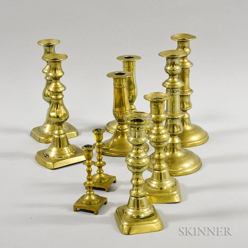 Four Pairs and Two Single Brass Candlesticks, England, 19th/20th century, ht. 8 1/2 in.