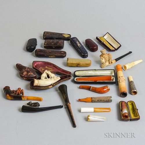 Group of Cased Pipes, including amber and Meerschaum examples with sterling and gold mounts.