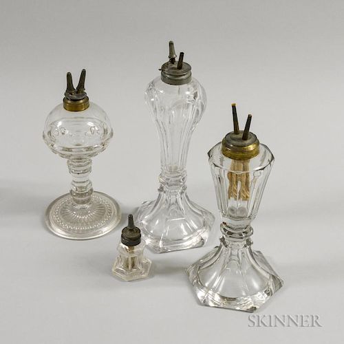 Four Colorless Pressed Glass Lamps, ht. to 11 1/2 in.