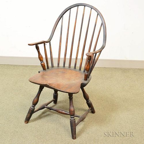 M. Rogers Black-painted Continuous-arm Windsor Chair, (damage), ht. 35 1/4, seat ht. 15 in.