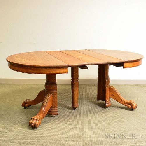 Large Carved Oak Dining Table, with three leaves, ht. 30 1/4, dia. 45 in.