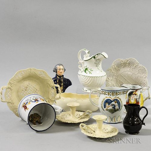 Twelve Pottery Items, England, 19th century, including two creamware chambersticks, three dishes, and a sauceboat, and four p