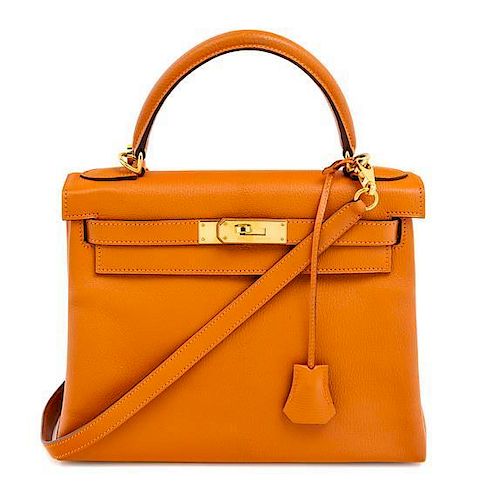 An Hermes Orange Retourne 28cm Kelly Handbag, 11" x 8.5" x 4"; Handle drop: 3.5".