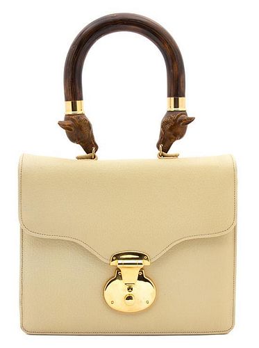An Anya Hindmarch Beige Leather Flap Handbag, 10" x 8" x 3".