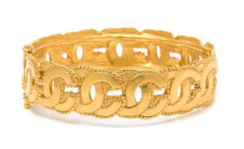 A Chanel Goldtone Bangle Bracelet, 8.5" circumference.