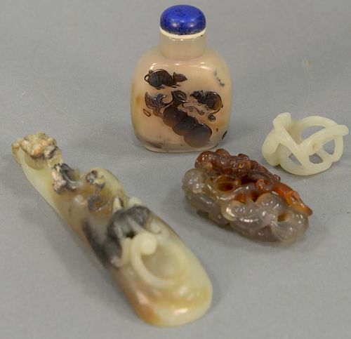 Four Chinese hardstone pieces including agate reticulated carved dragon (lg. 2 1/2in.), jade pendant, dragon belt hook (lg. 5